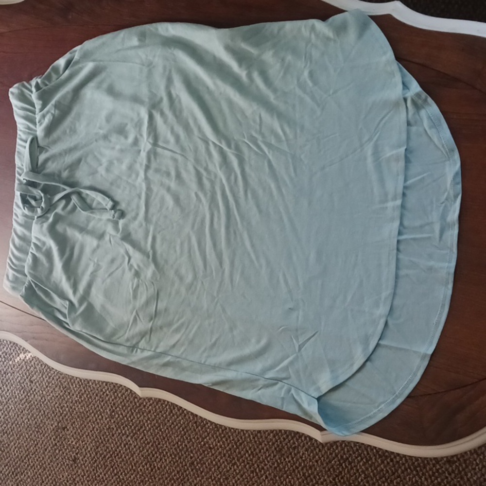 Mint green skirt.